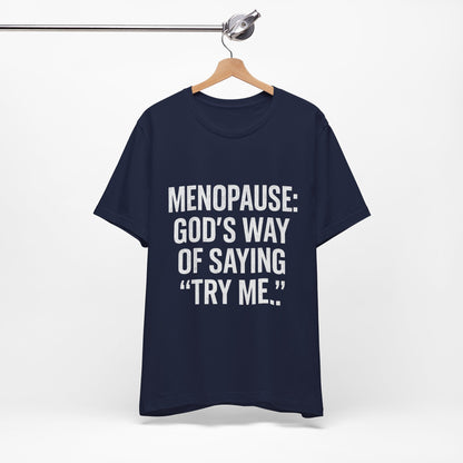Menopause Tee — “Menopause: God’s Way of Saying ‘Try Me’” Short Sleeve Shirt