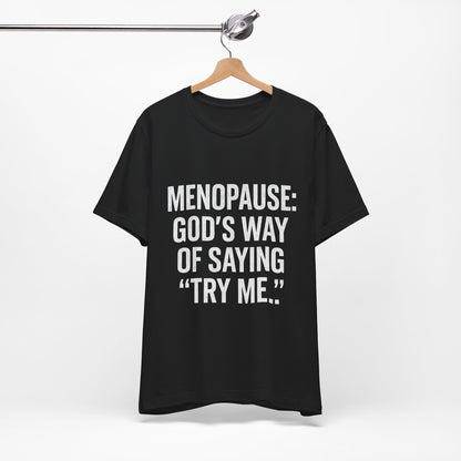 Menopause Tee — “Menopause: God’s Way of Saying ‘Try Me’” Short Sleeve Shirt
